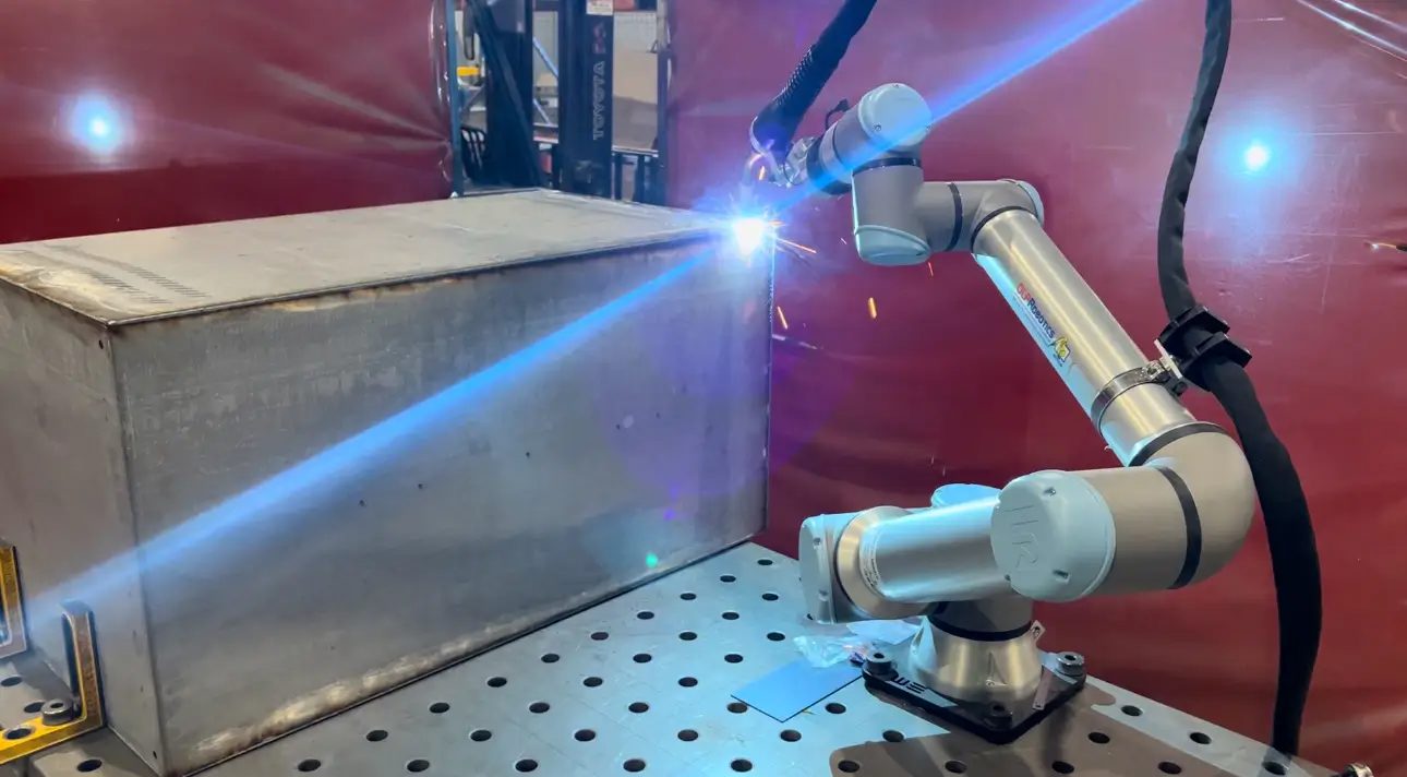A robotic welding cell running on the Academy floor