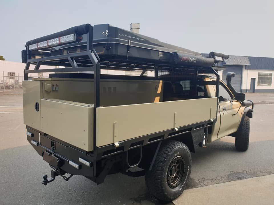 A touring canopy and roof rack build on a single cab ute
