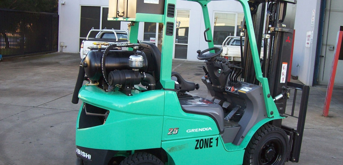A modified forklift finished and ready to leave the shop