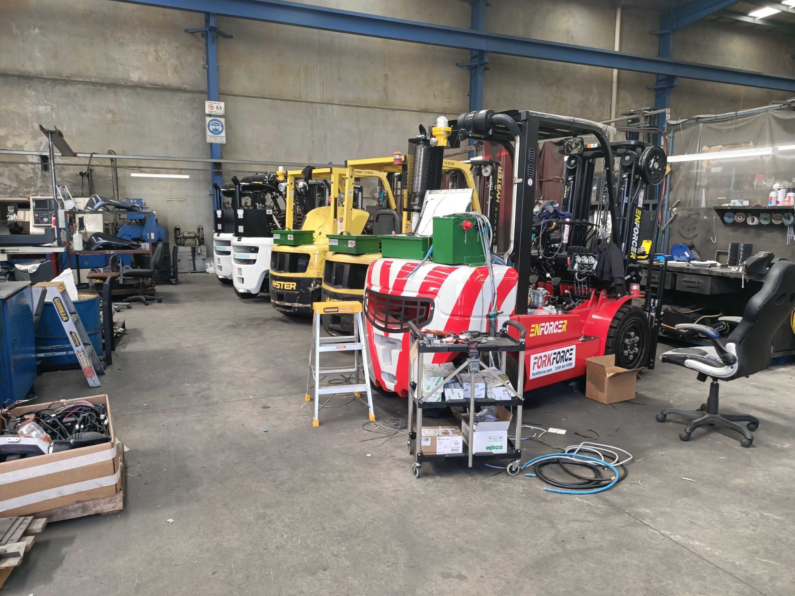 A forklift being rebuilt on the Forktorque workshop floor
