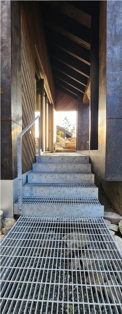 Grated steel steps in a narrow corridor