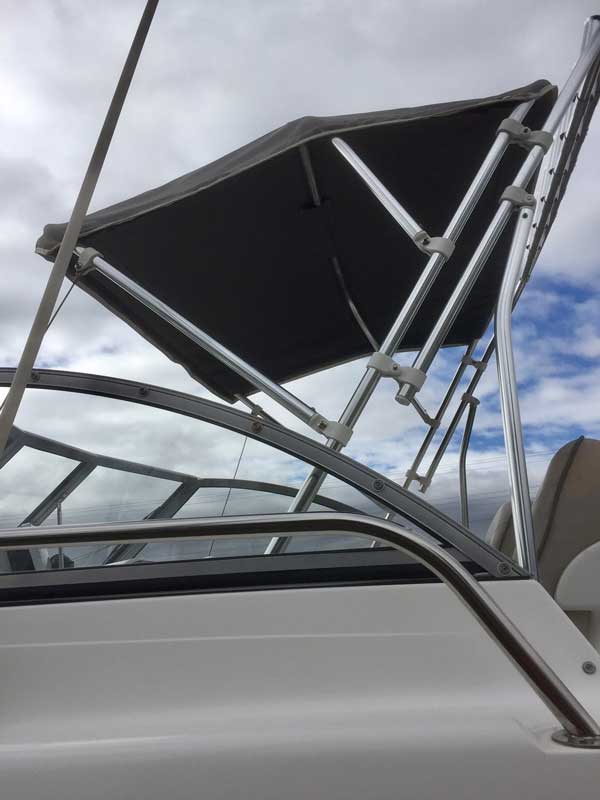 A polished stainless marine bimini frame