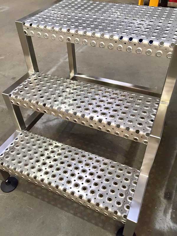 A stainless perforated-tread step unit