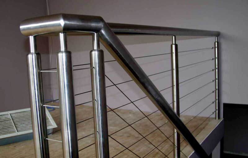 A stainless cable-wire balustrade fabricated and installed by Sandwith